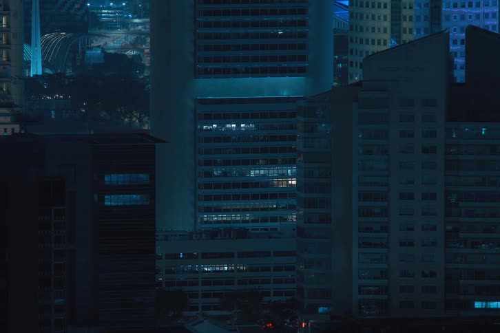 Three buildings with apartment lights turning  off quickly