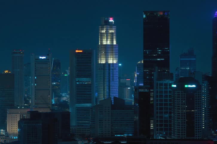 The lights in the building windows flash at night then turn off