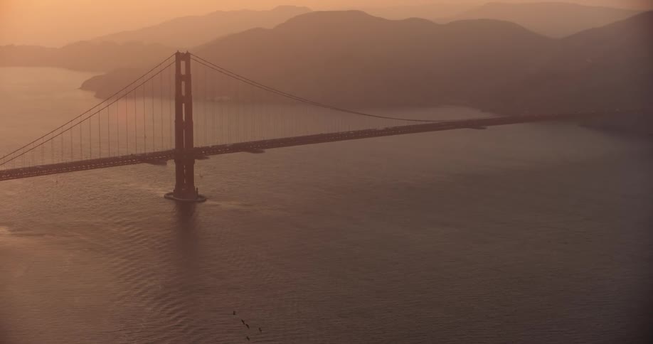 Aerial view of a Golden Gate Bridge at sunset