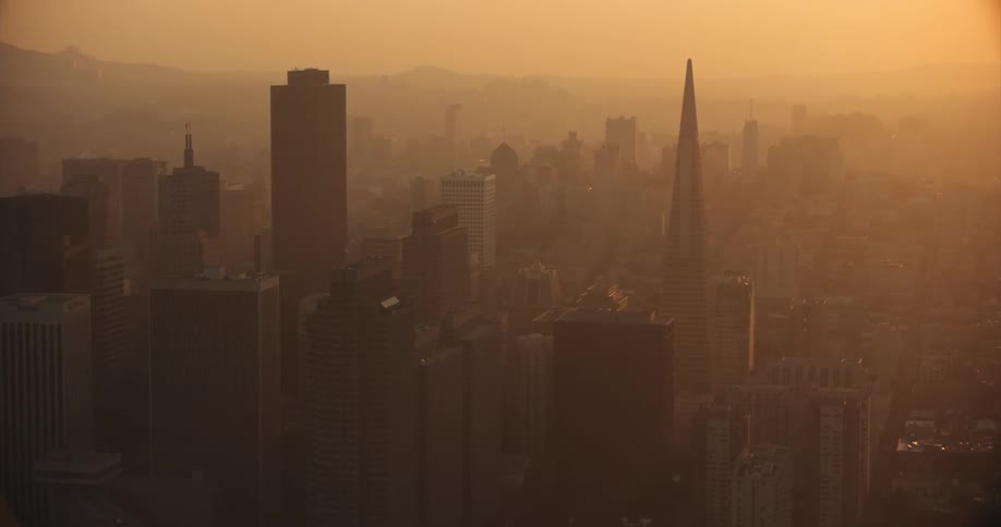 San Francisco, Aerial of a city skyline at sunset covered in an orange smoky haze