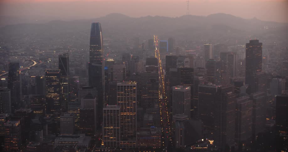 San Francisco, skyline of an urban city with fog at dusk