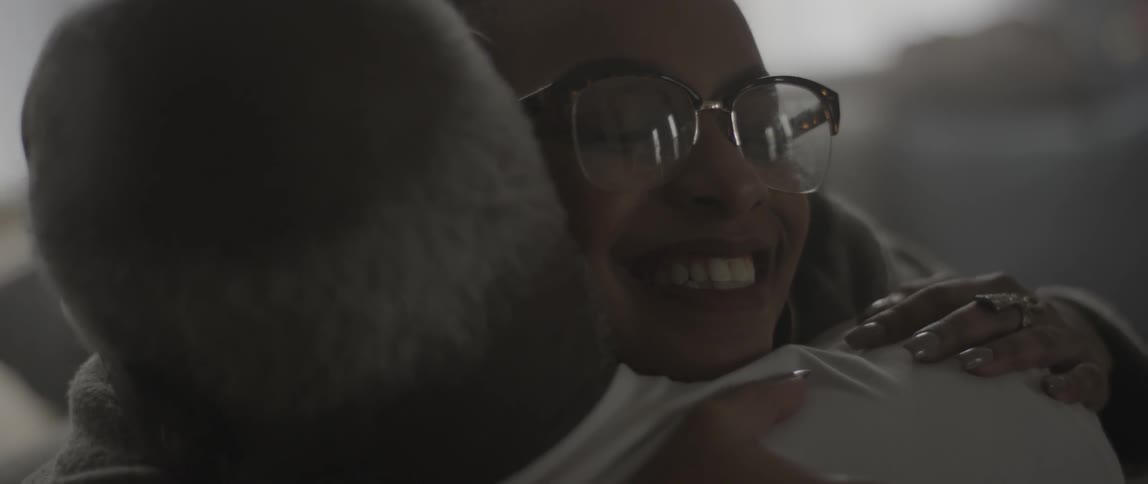 A man and woman hug each other