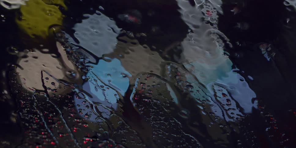 Rain falls on a window