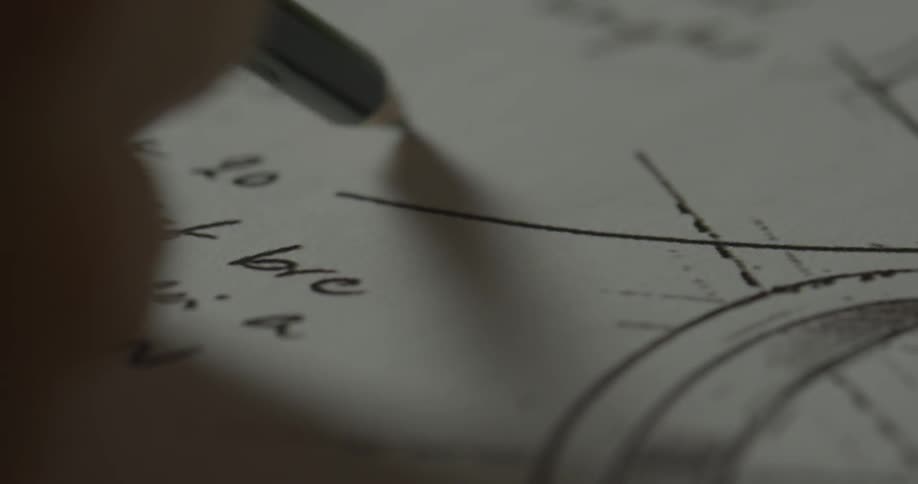 Person writes with a pencil on a paper with other writing