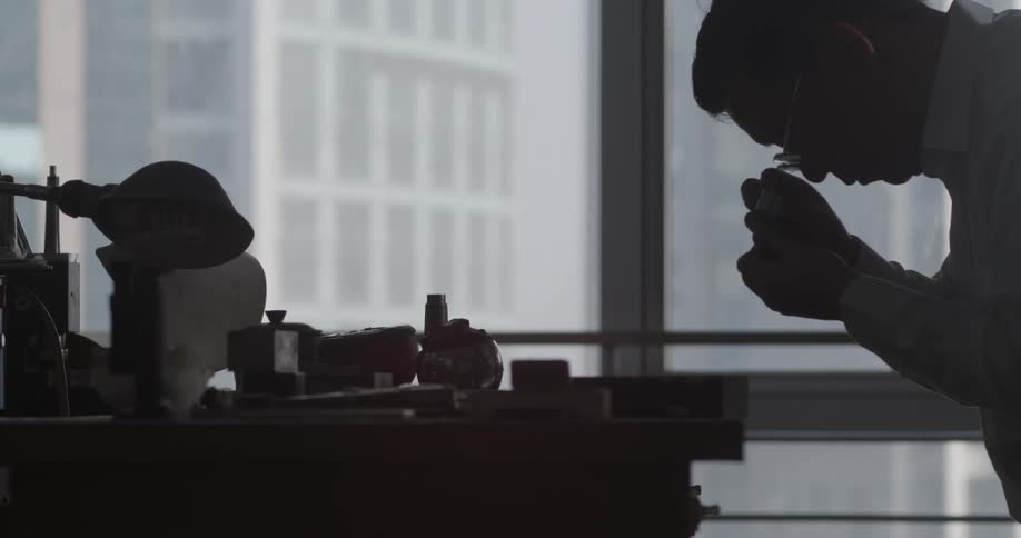 A man in an office building working at his desk