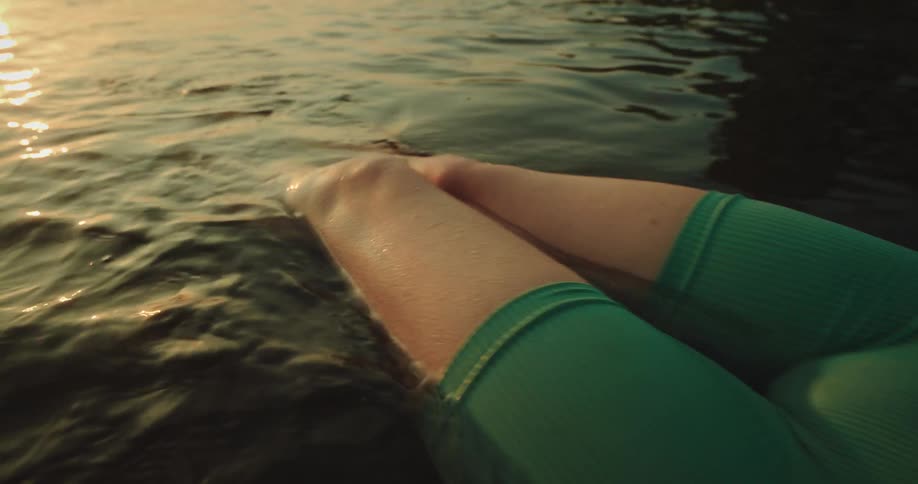 A woman floating on water during the day
