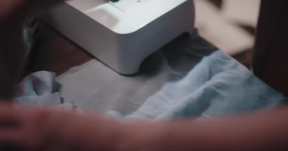 Girls cutting a fabric to make a fashion outfit