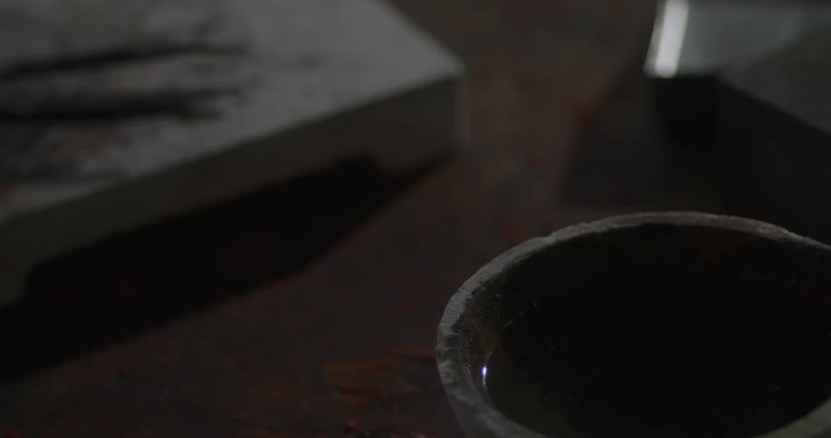 A bowl of liquid on a table