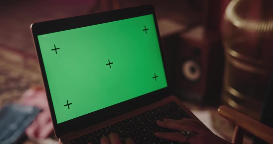 A woman is typing on her laptop