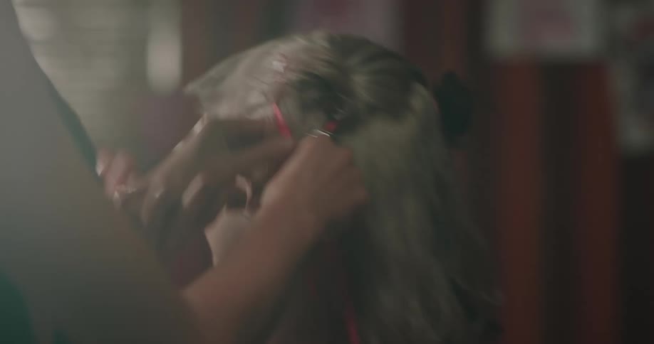 Two women are playing around with ribbons