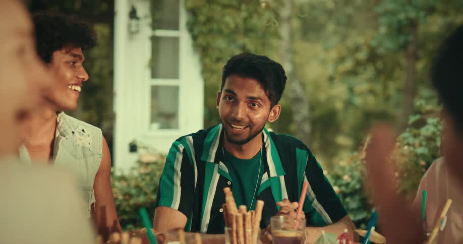Friends sitting at a table talking to each other