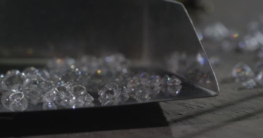 Diamonds lay in a metal container