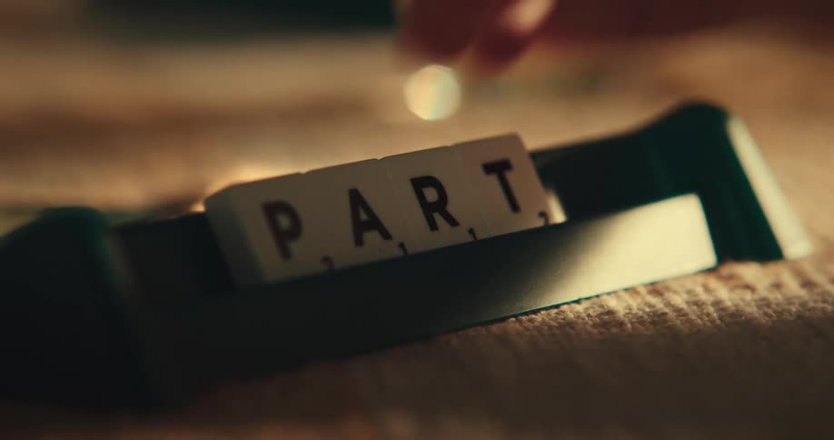 A person is playing a game of scrabble