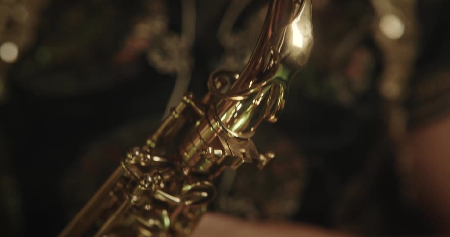 A woman playing the saxophone with her eyes closed