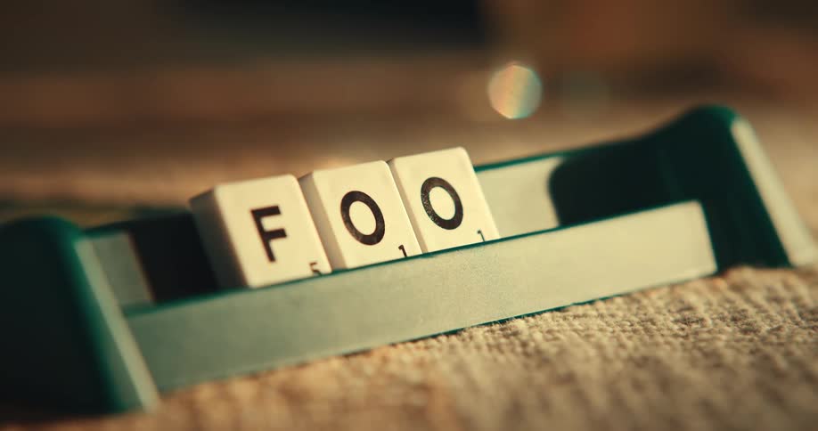 Scrabble tiles placed down to spell food