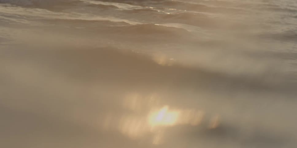 Sunshine glistens off of flowing water