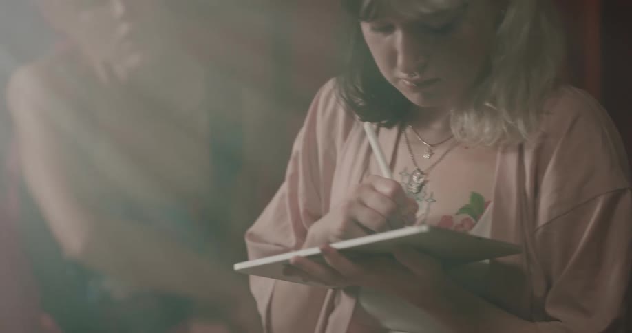 A clip of two female having a conversation and also keeping records