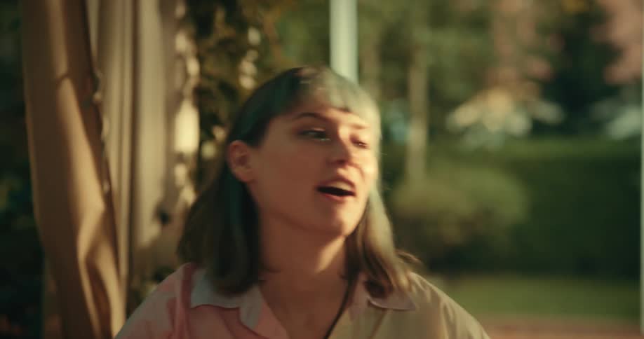 A group of female friends converse and laugh with each other