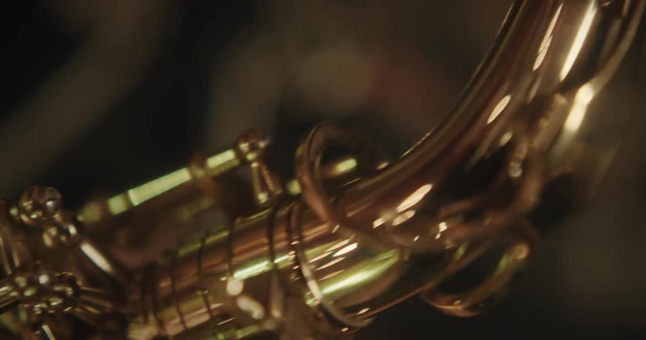 Woman playing a trumpet with her eyes closed
