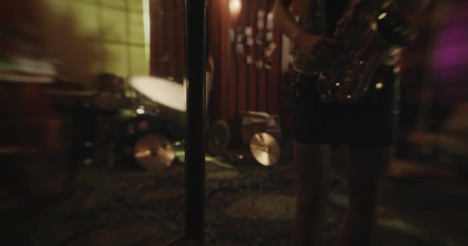 A woman is playing the saxophone