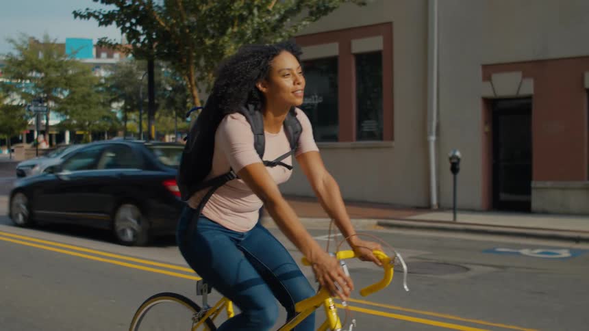 Woman riding a bicycle on a city street