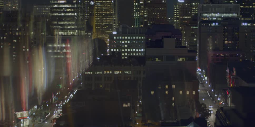 View looking out the window at a city at night