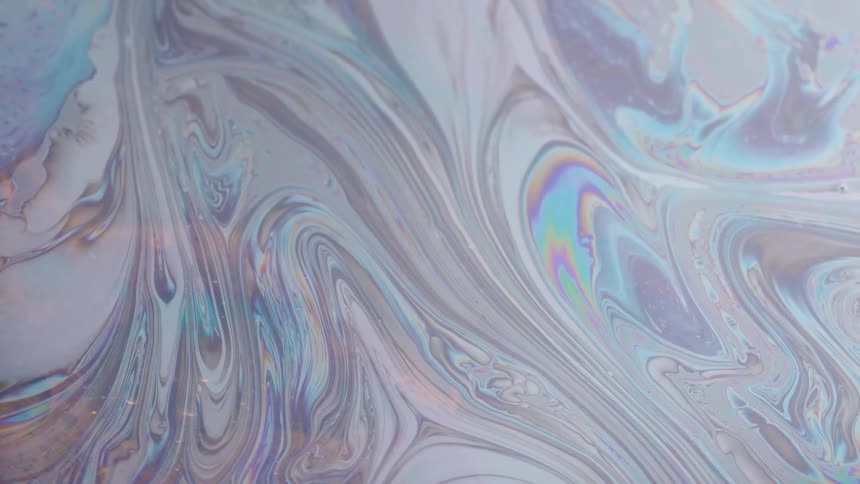 White substance with pastel colored stripes bends and curves