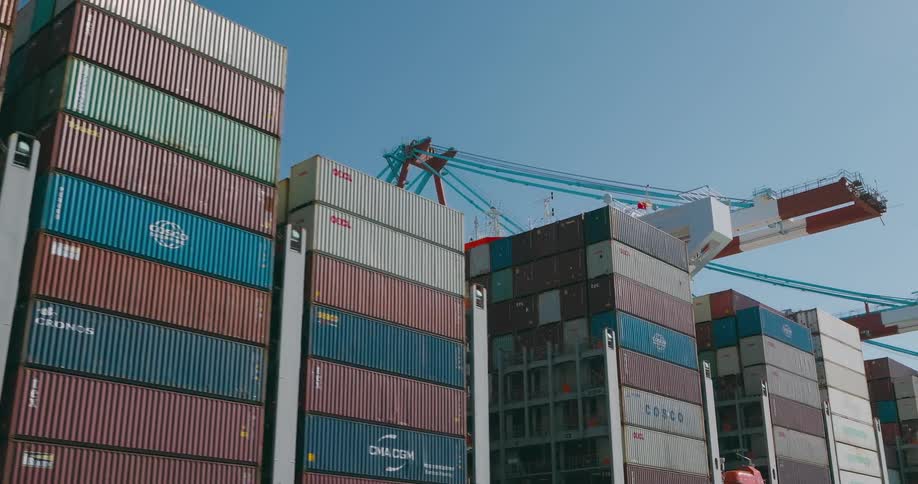 Ship with containers docked at a logistics center port on a clear bluesky day