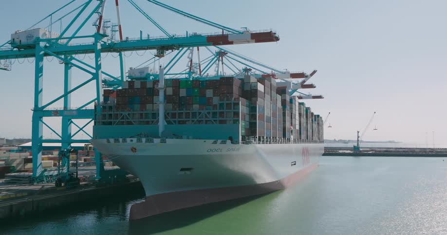 Panorama of a ship loaded with containers docked at a logistics center port