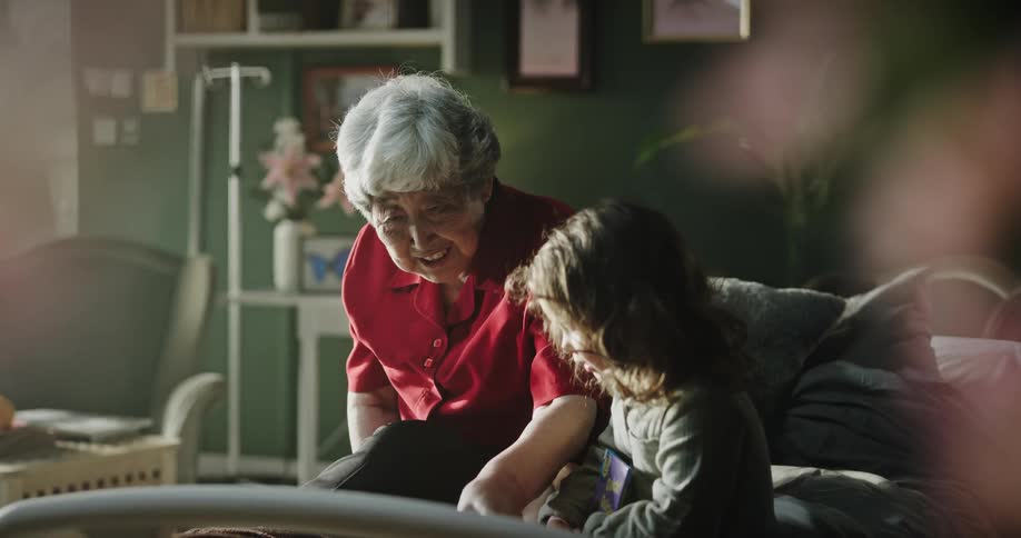 A grandmother playing with her granddaughter