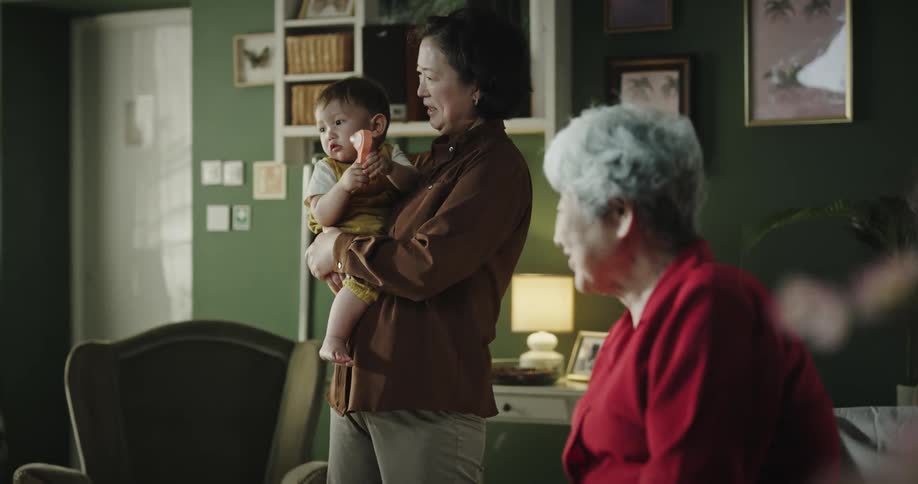 Girl playing with her grandmother in the living room