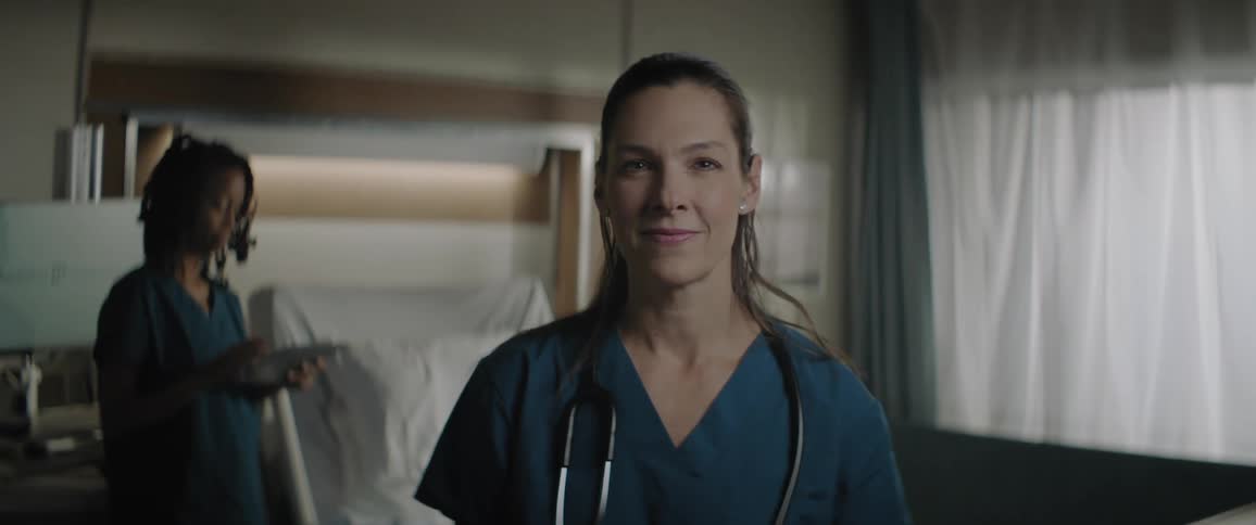 Closeup of a smiling female doctor in a hospital room