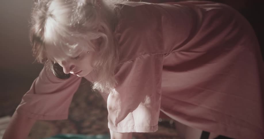 A clip of a female on a pink dress