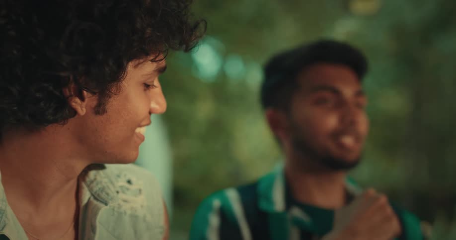 A man is talking with some friends