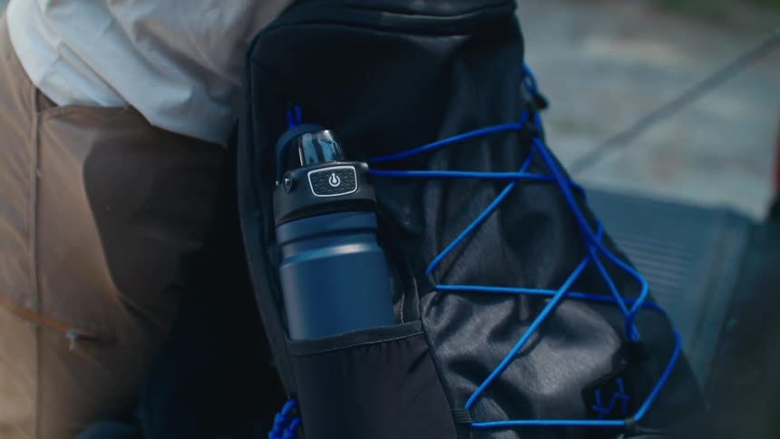 A man packs his backpack and goes hiking