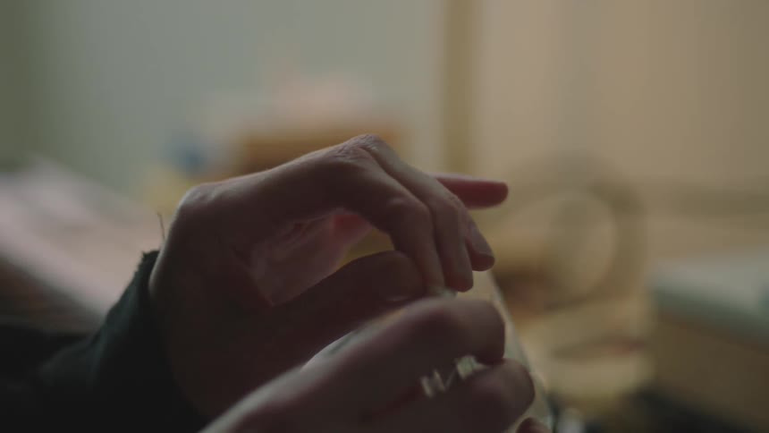 Closeup of a persons hands opening a cd