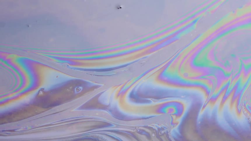 Rainbow colors move around in the ink