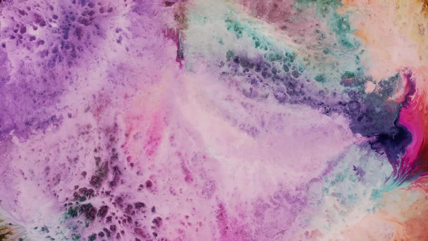 Extreme closeup of light pastelcolored paint bubbling in slow motion