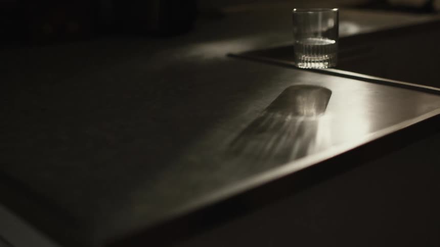Glass floating on top of the sink