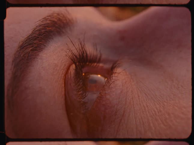 Extreme closeup of a womans eye blinking