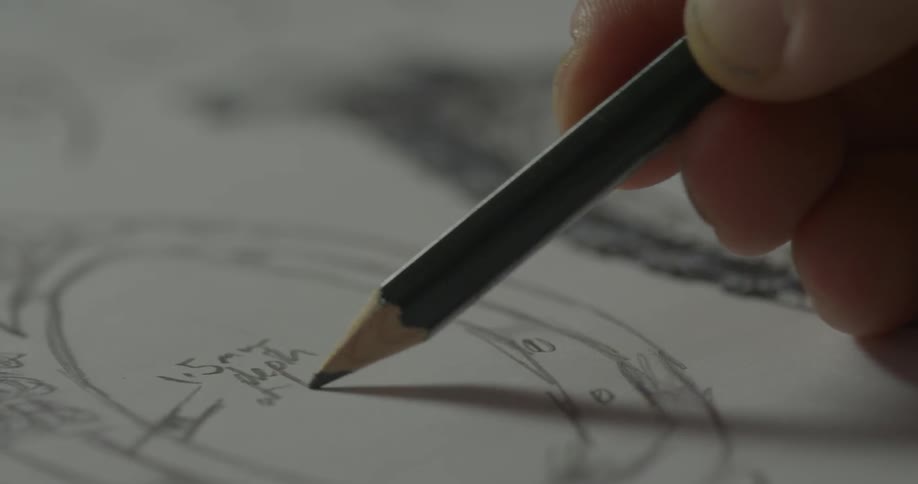 A person labels their sketches
