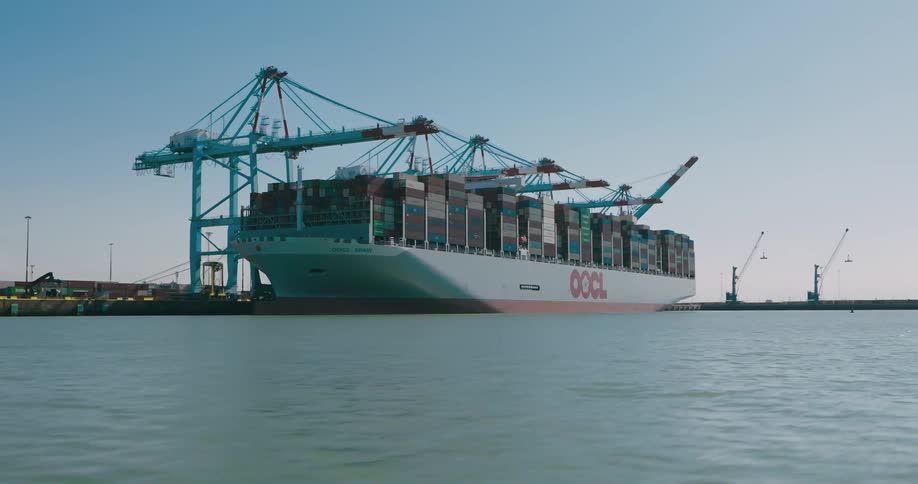 Panorama of a boat loaded with containers next to a logistics center port