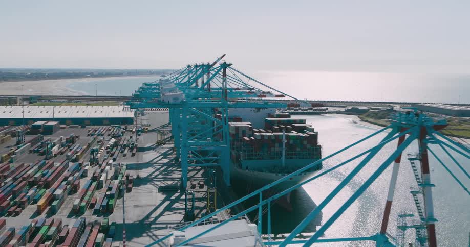 Ship with containers docking at a logistics center port