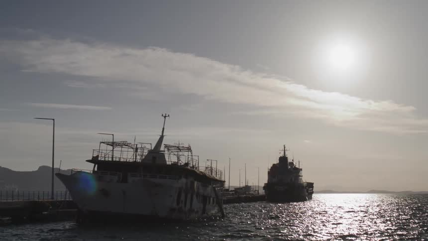Cargo ships anchored in the port during the sunny morning