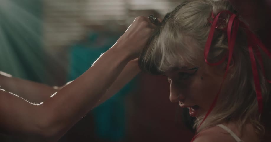 Woman putting bows in another womans hair