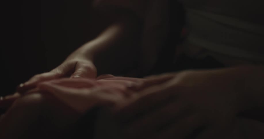 A close up clip of a female assessing a clothing material