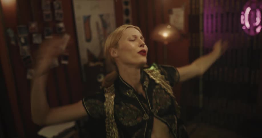 A woman is dancing in the room