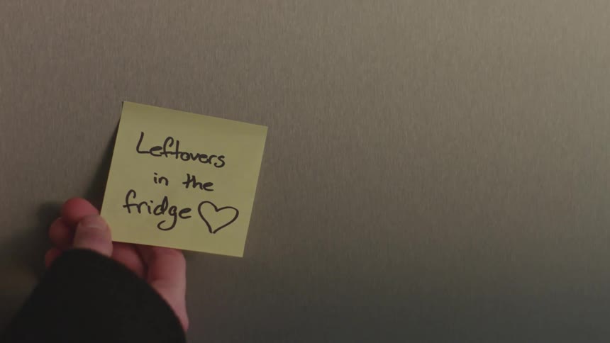 A reminder stuck to the refrigerator door