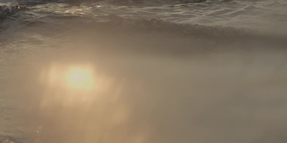 Sunshine glistens off of flowing water