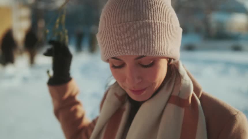 A woman walks in the snow
